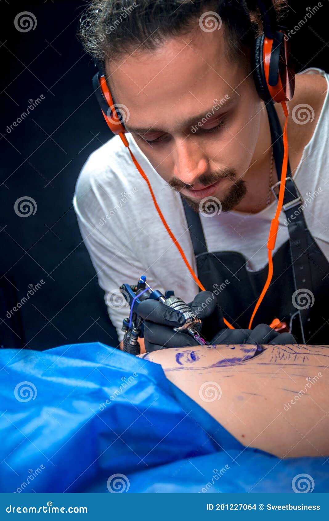 Tattooist Making a Tattoo in a Studio Stock Photo Image of