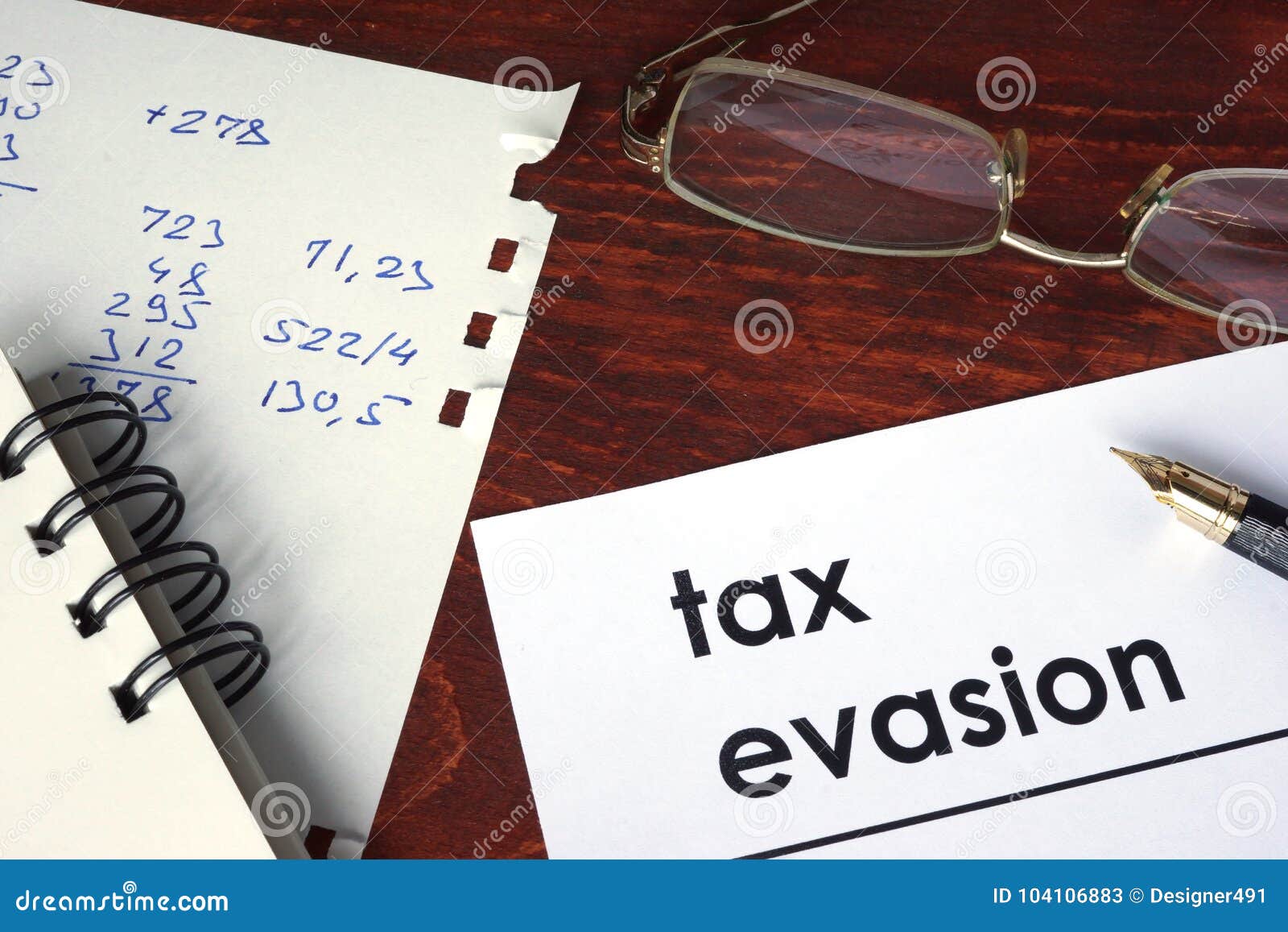 tax evasion written on a paper.