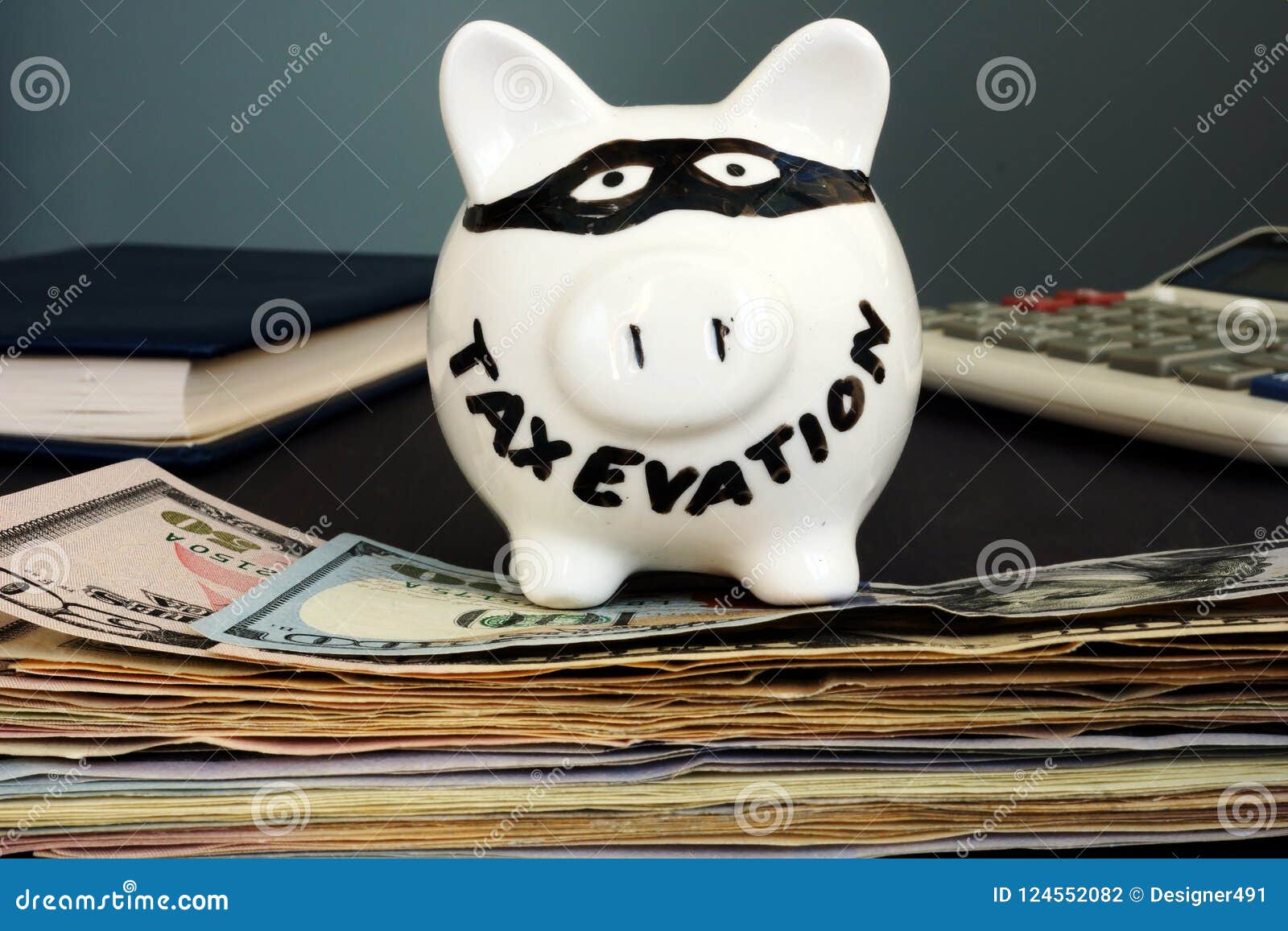 tax evasion written on the piggy bank.