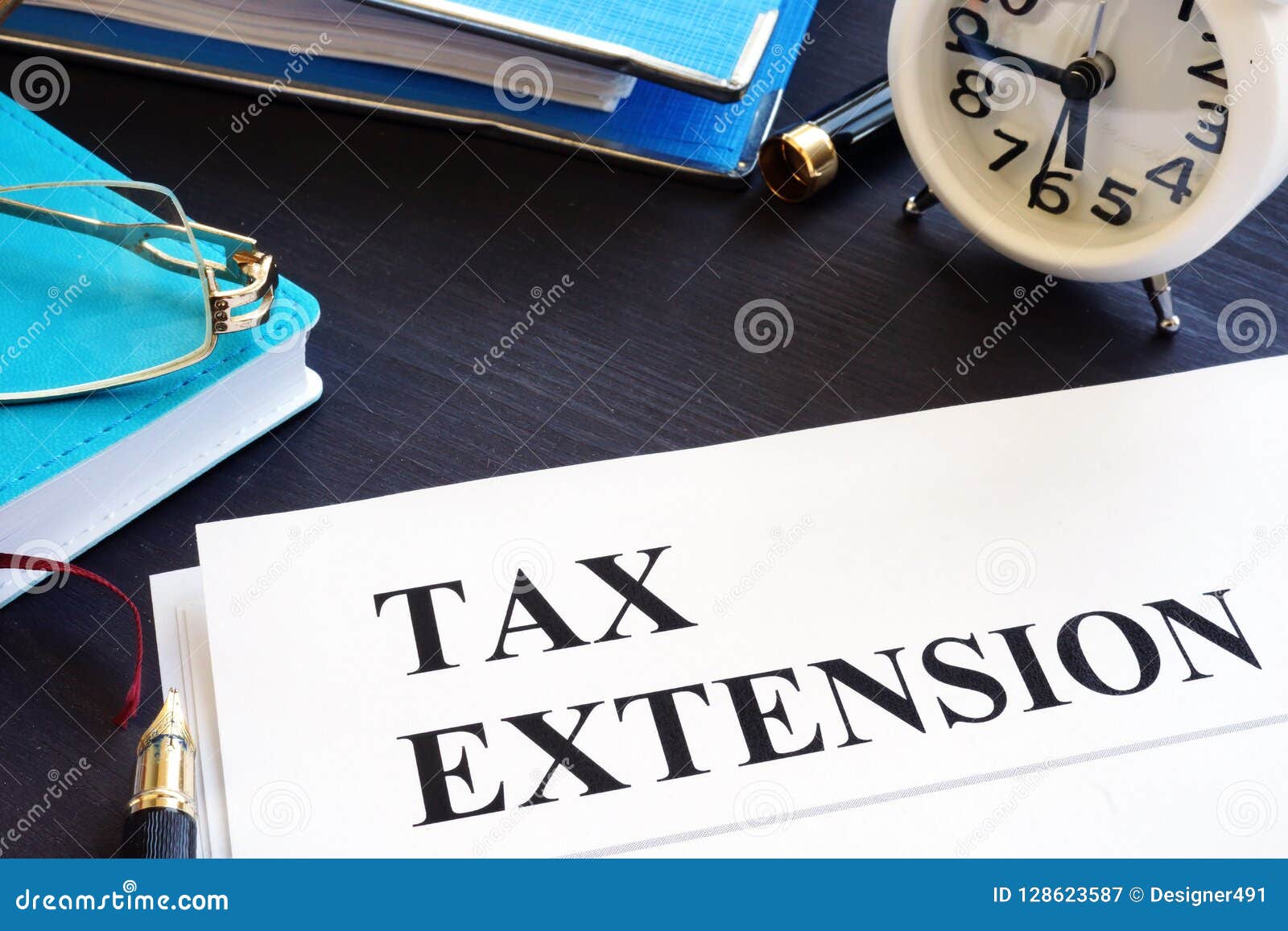 tax extension. folder with documents and clock.