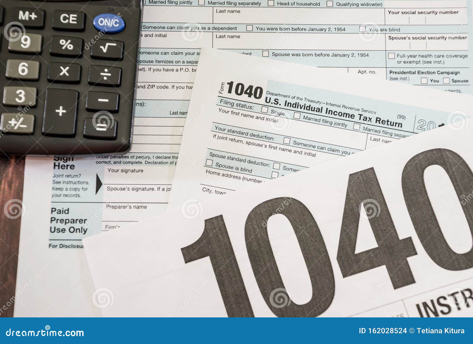 Tax Form 1040 and Calculator. Top View. Closeup. Editorial Stock Image
