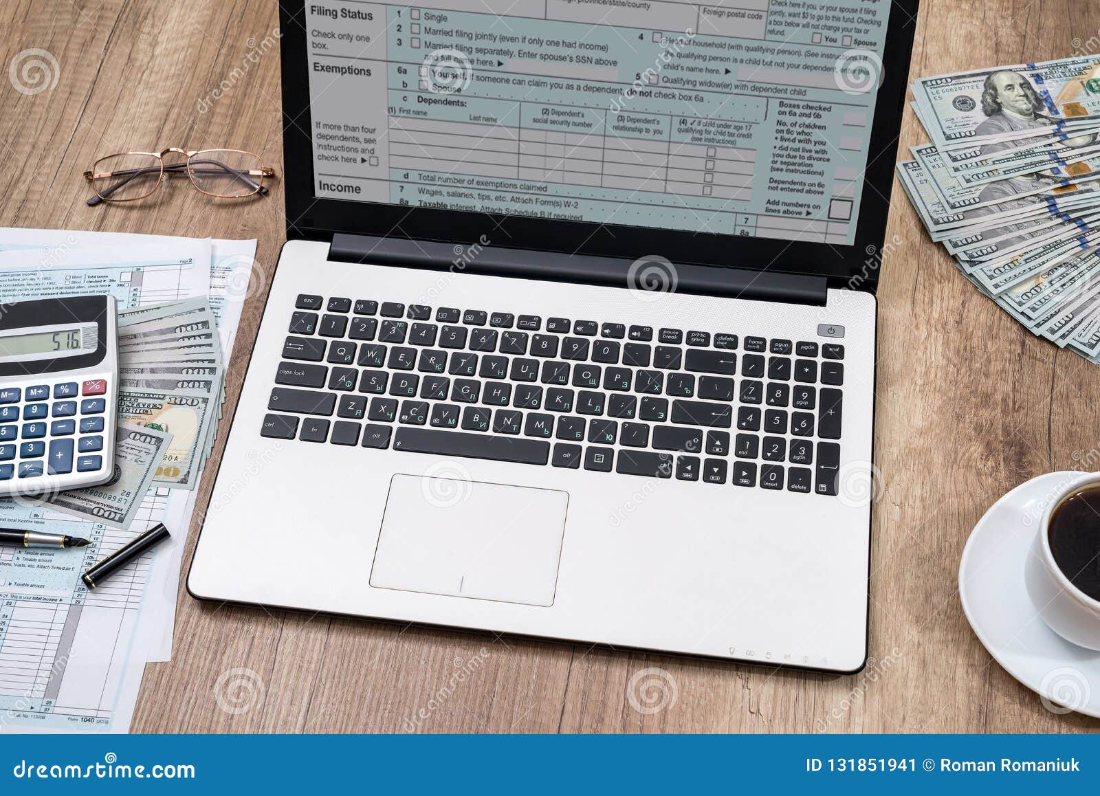 Tax Form Laptop Coffee And Dollar On Desk Stock Image Image Of