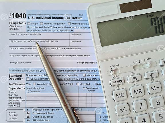 tax-forms-pen-and-checks-with-calculator-editorial-photography-image