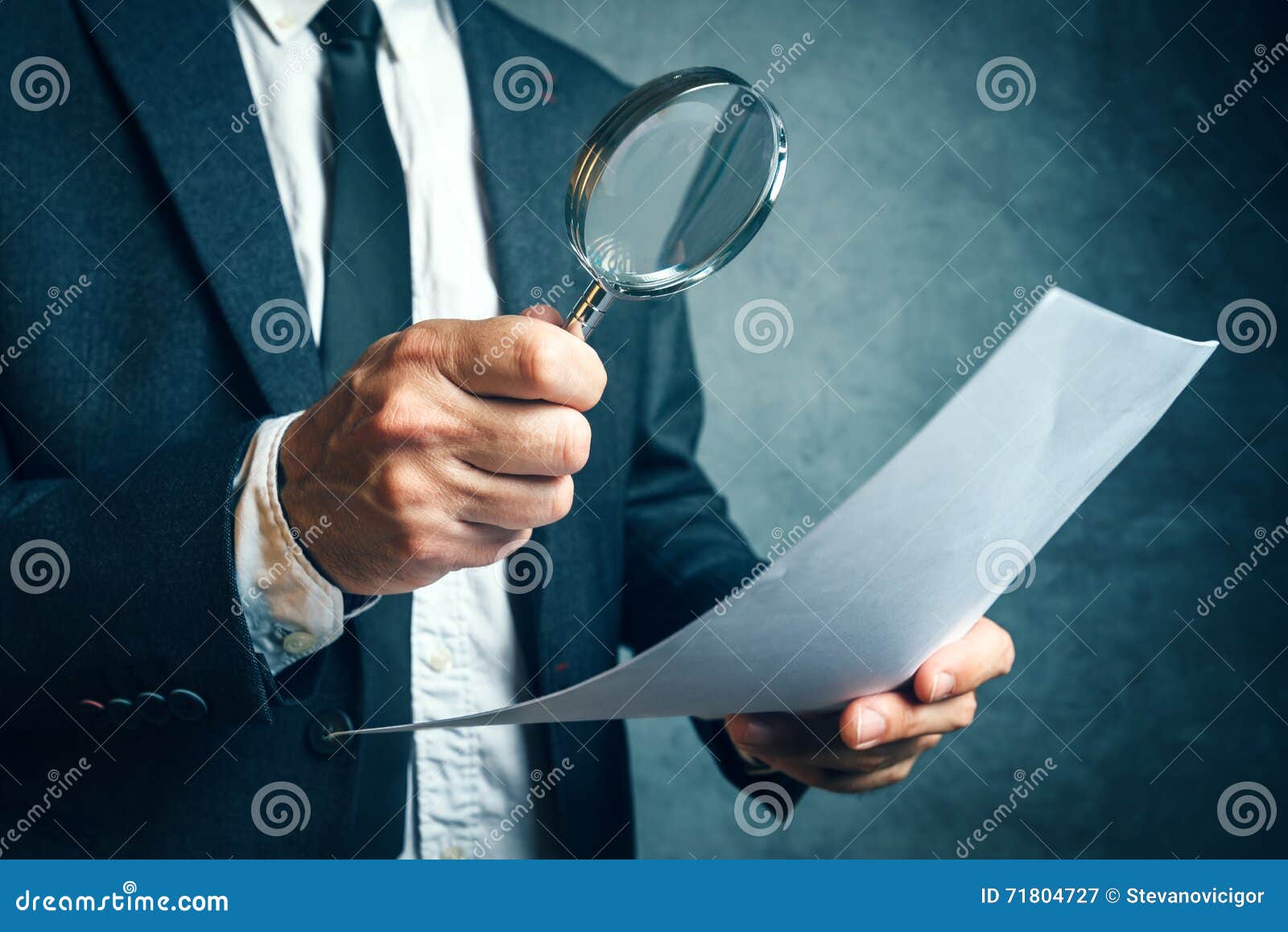 tax inspector investigating financial documents through magnifying glass