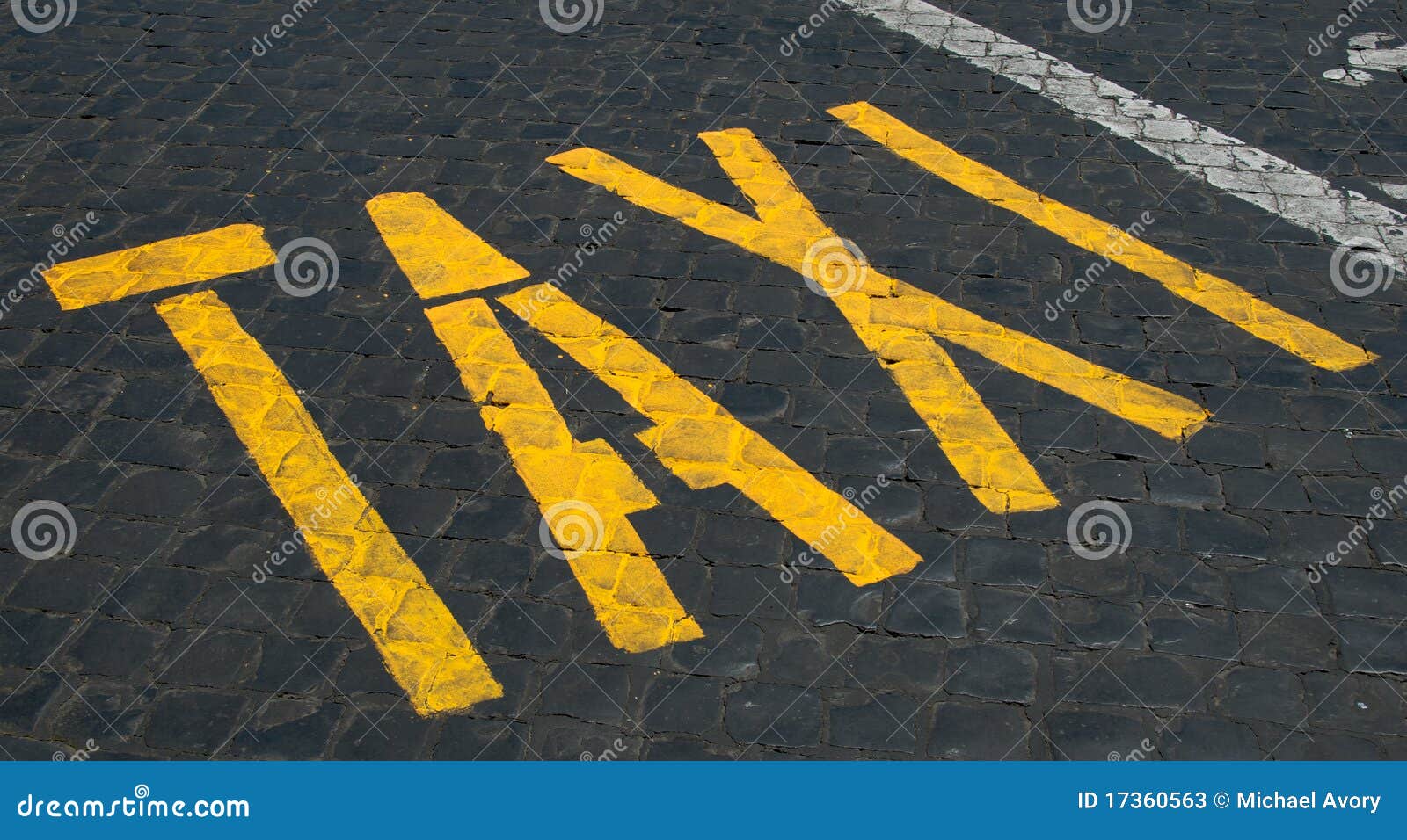 taxi sign on cobblestones
