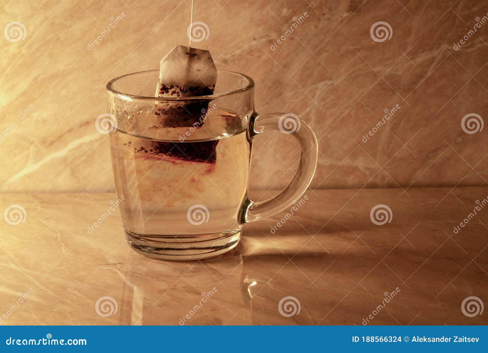A Tea Bag Has Been Dropped into a Mug of Boiling Water Stock Photo