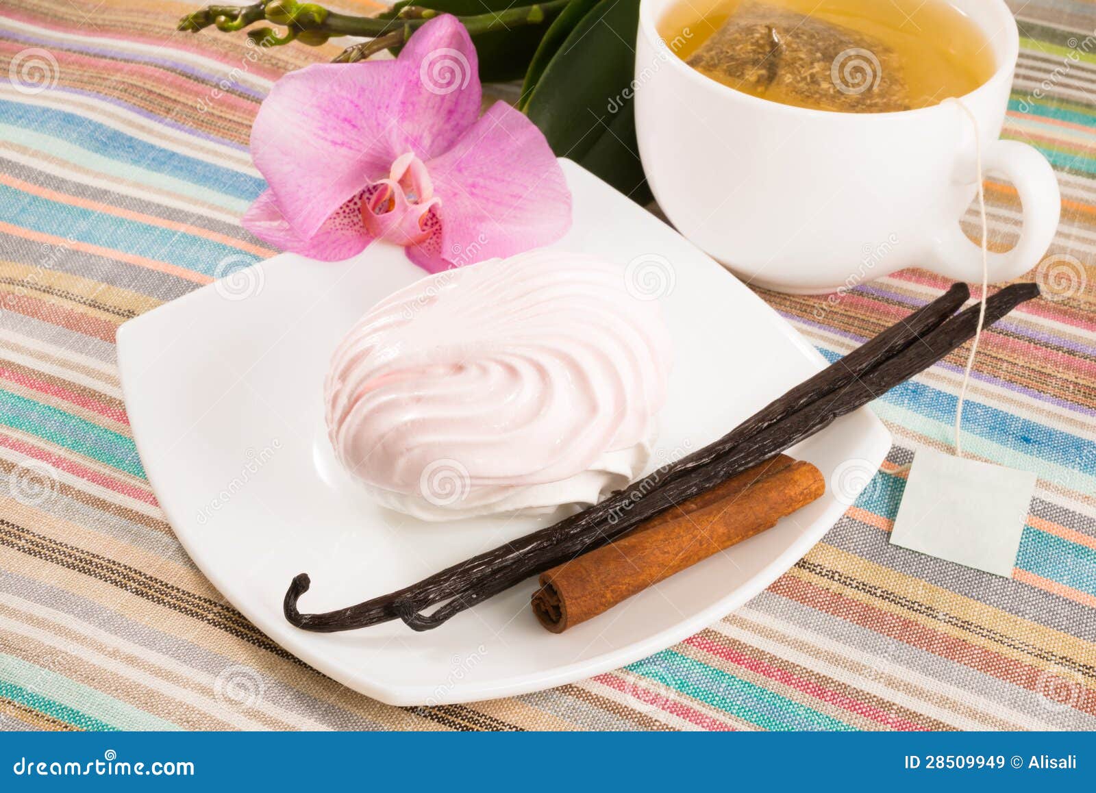 Tea Bag and Pink Marshmallow on a Saucer with a Vanilla, Cinnamon Stock