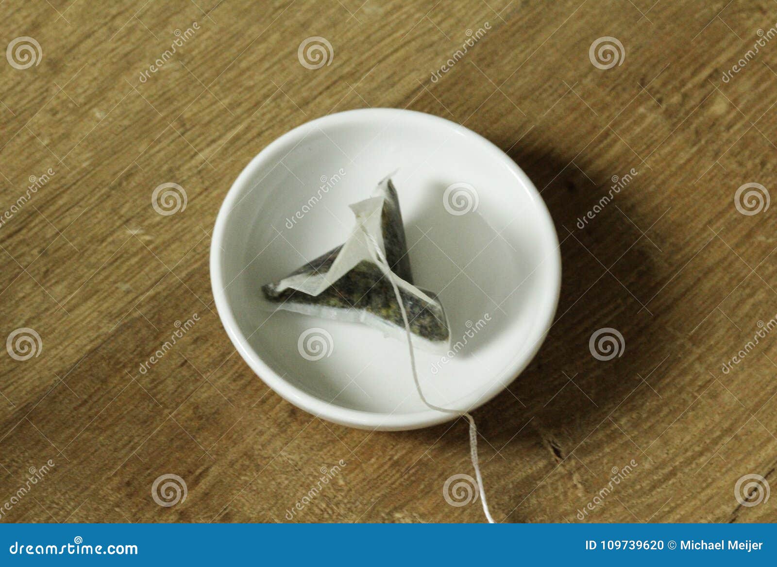 Tea bag on plate stock photo. Image of green, morning 109739620