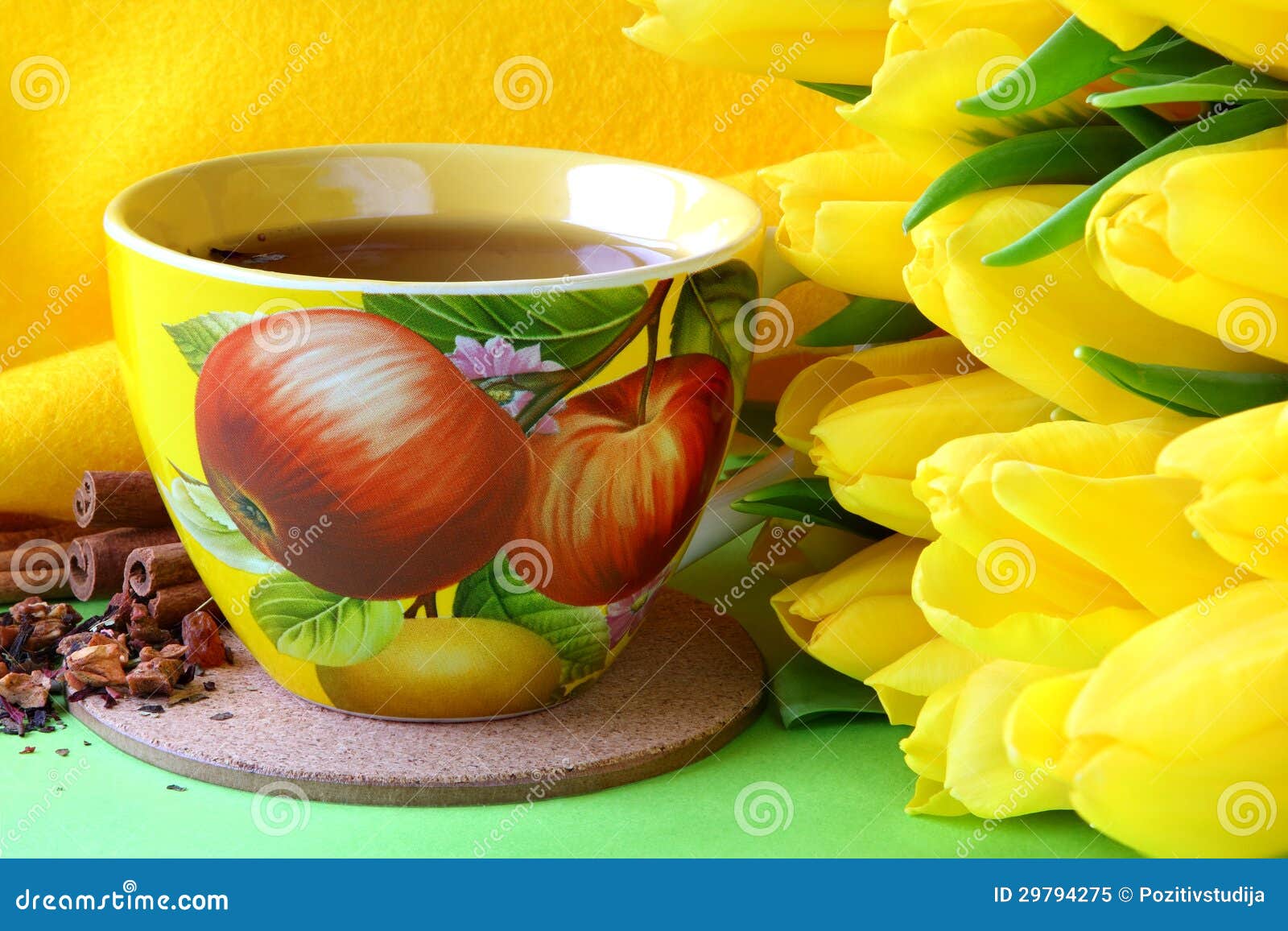 Tea cups and yellow tulips stock image. Image of drink 29794275