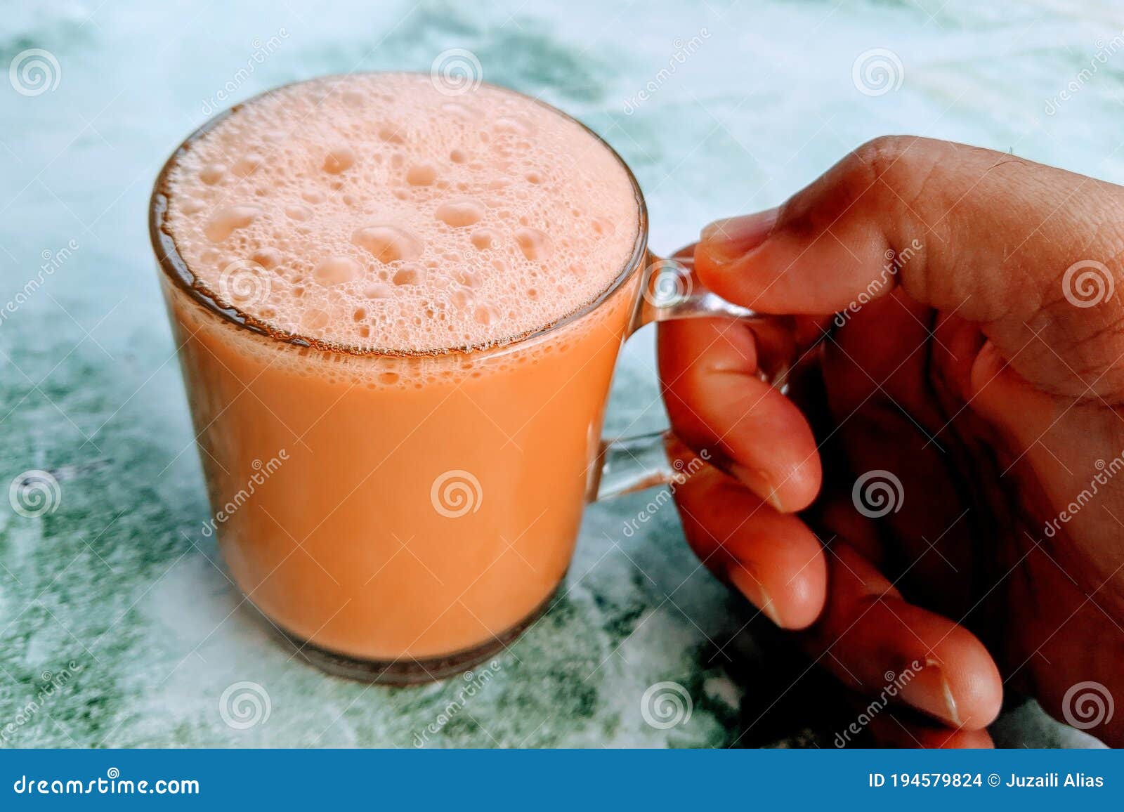 Tea With Milk Or Popularly Known As Teh Tarik Over White Background