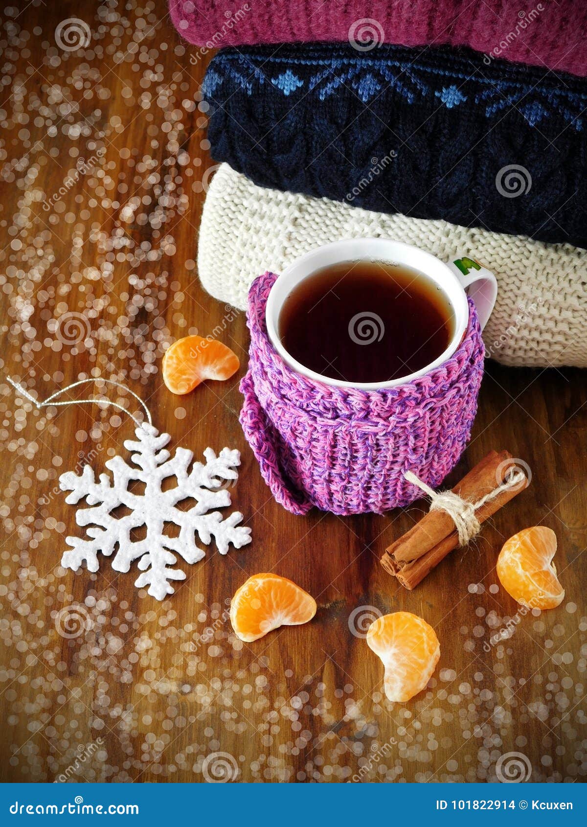 Tea in a Mug Wrapped into Tiny Scarf Surrounded by Mandarin Segments