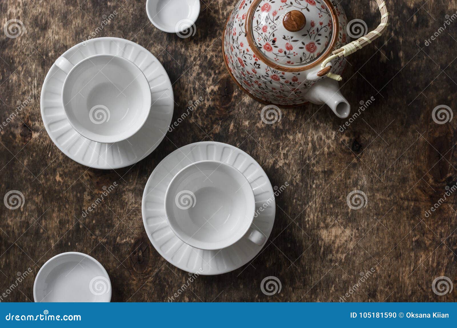 Tea Set on a Wooden Table, Top View. Teapot, Empty White Tea Cup on a