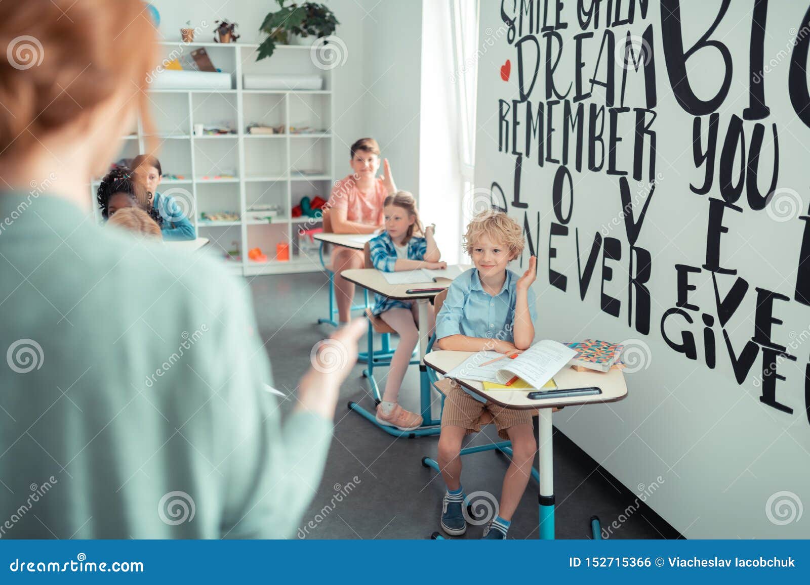 teacher calling pupils to read the task.