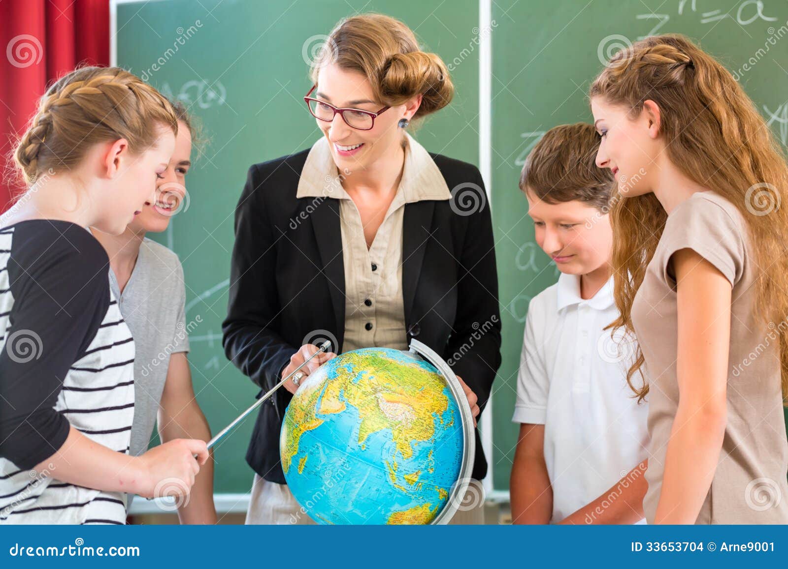 teacher educate students having geography lessons in school