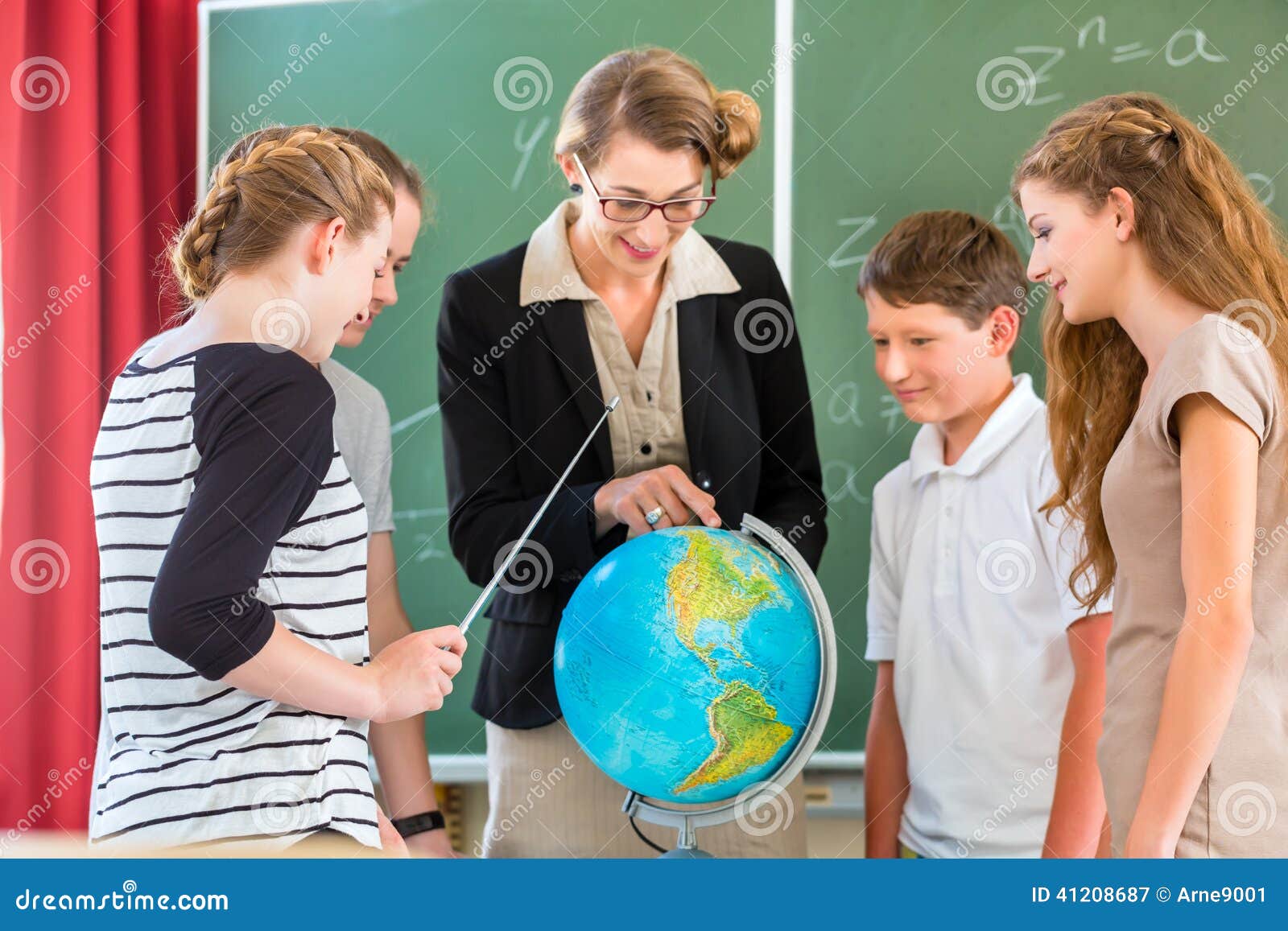 teacher educate students having geography lessons in school