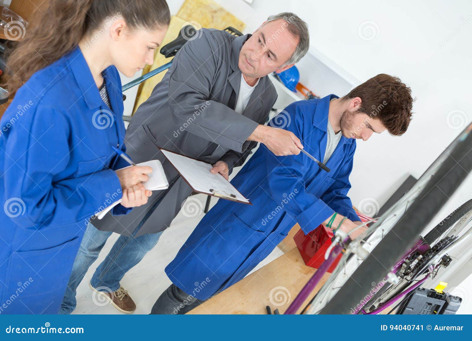 Teacher Engineer and Students by Electrical Motor Control Panel Stock