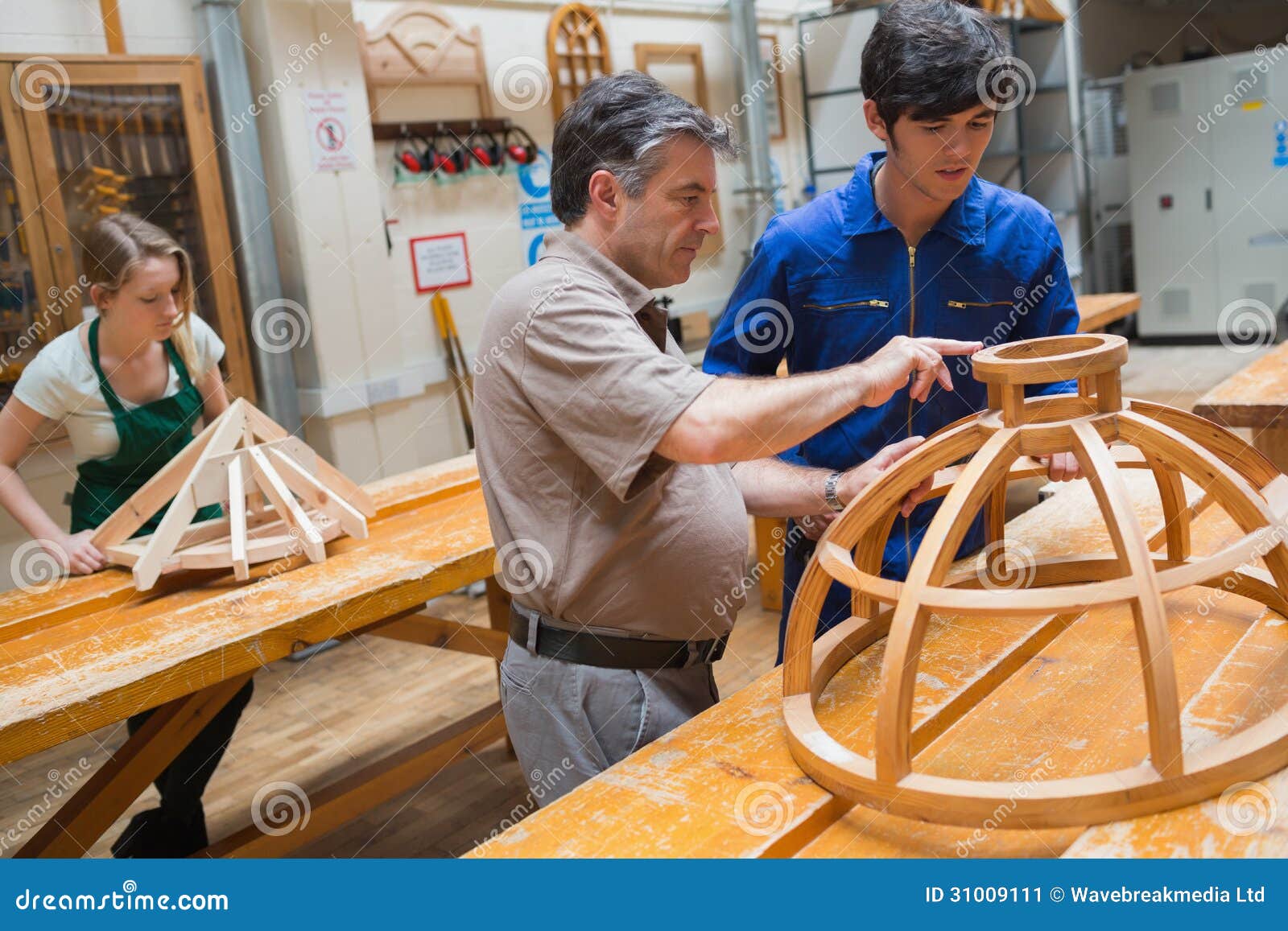 Teacher Helping a Student in a Woodwork Class Stock Image Image of