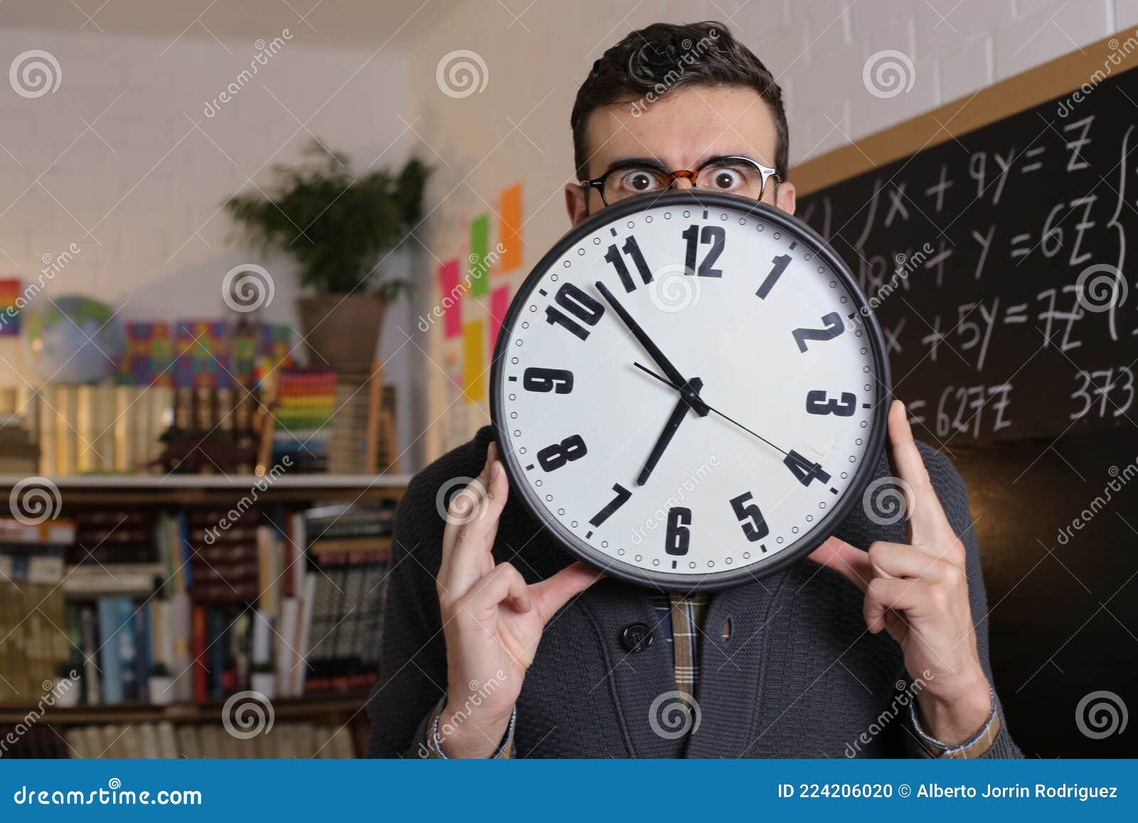 Teacher Holding Large Clock in Classroom Stock Photo Image of
