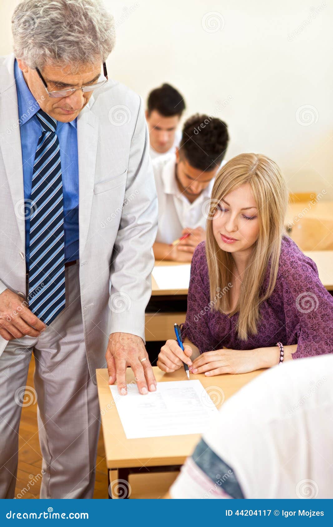 teacher observes his students