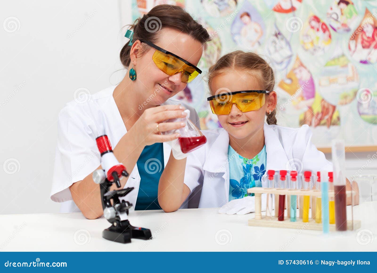 Teacher Showing Basic Chemistry Experiment To a Little Student Stock