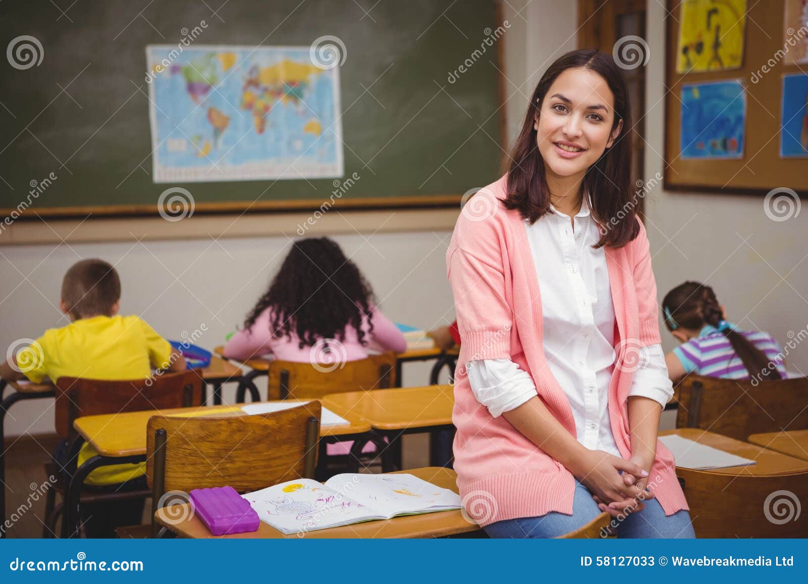 Teacher Sitting Behind Her Students Stock Image Image of adult