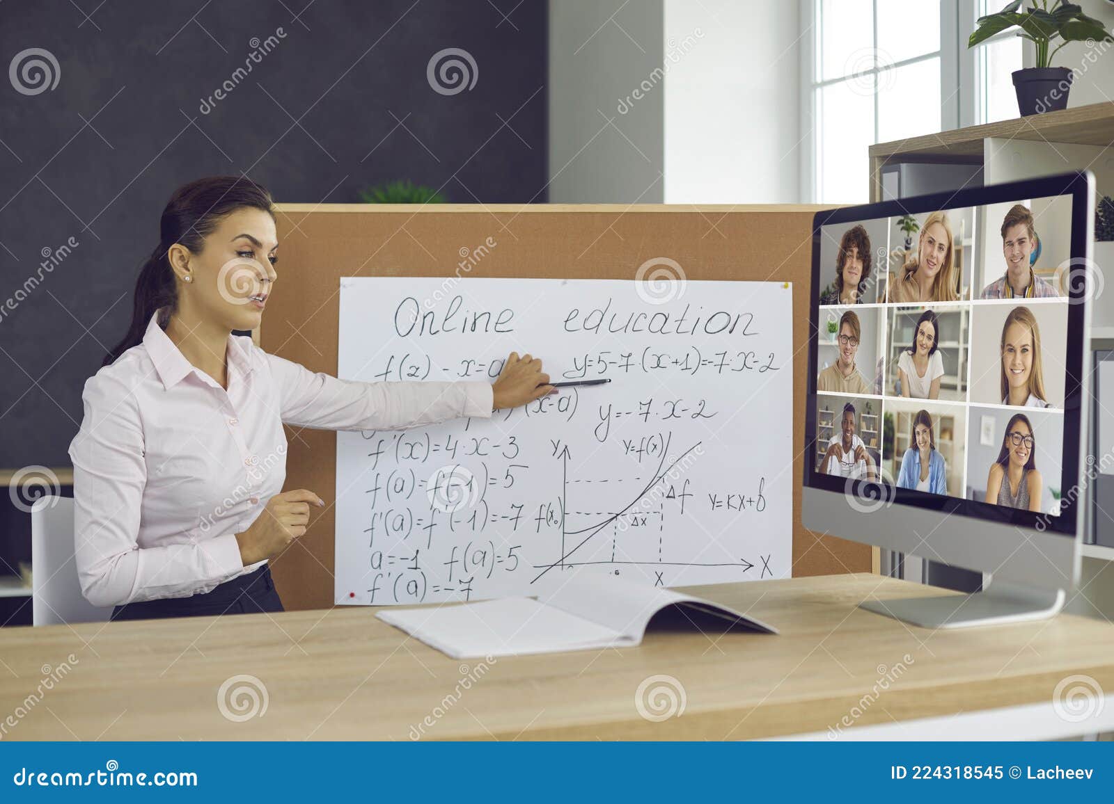 Teacher Sitting at Desk and Pointing at Board during Online Class with  Group of Students Stock Image - Image of conference, board: 224318545