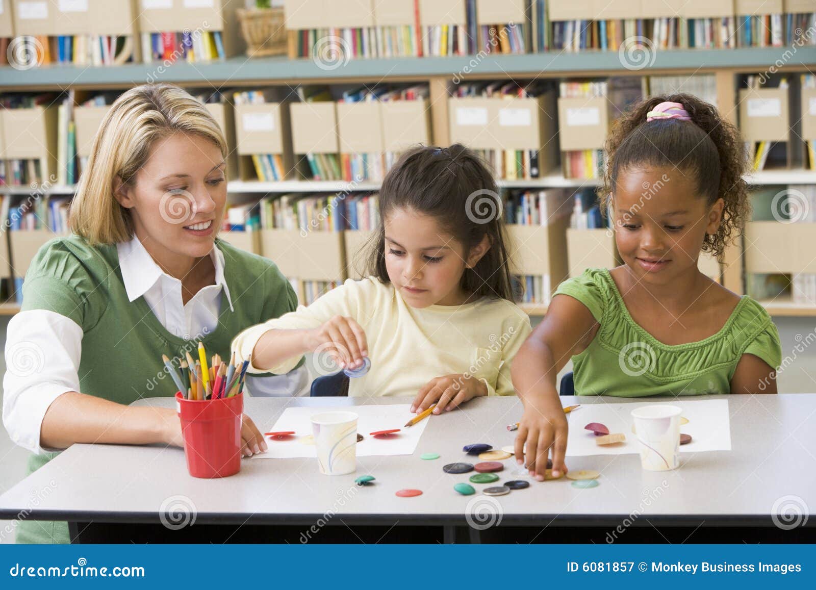 Teacher Sitting with Students in Art Class Stock Image Image of