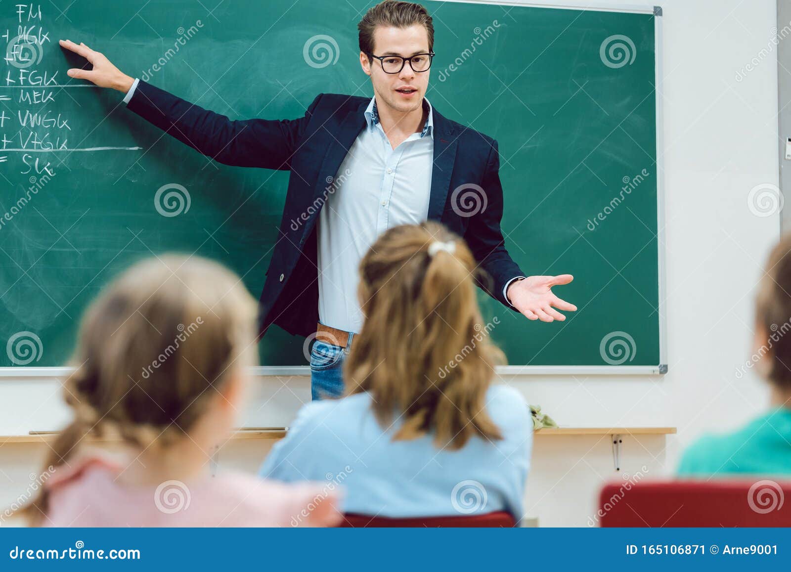 Teacher Standing in Front of Students in School Class Stock Image