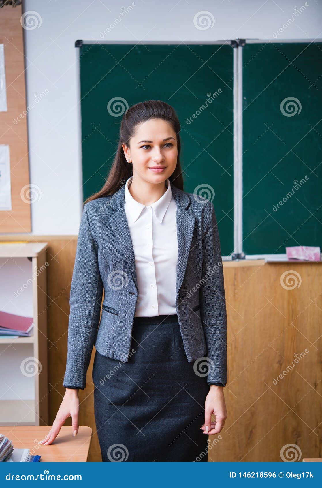 The Teacher Stands in the Middle of the Classroom Stock Photo Image