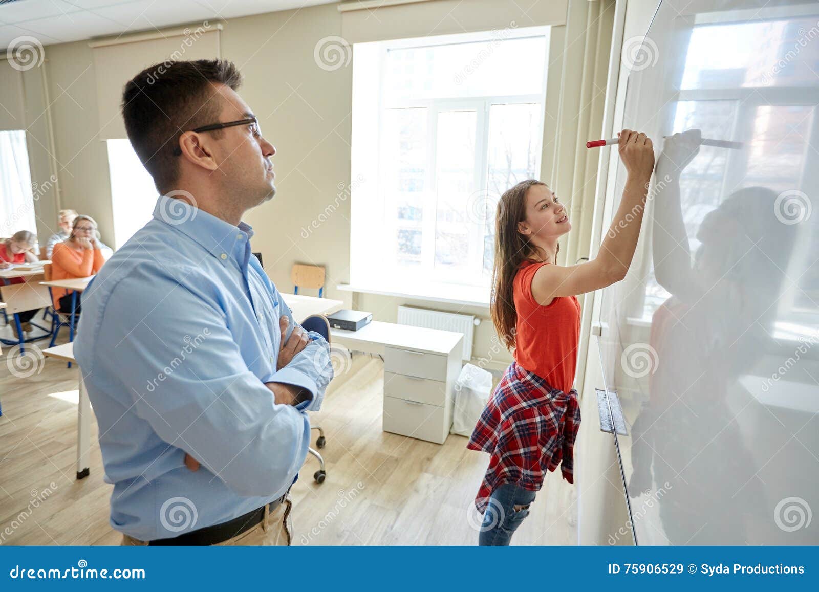 Teacher And Student Writing On Board At School Stock Image - Image ...