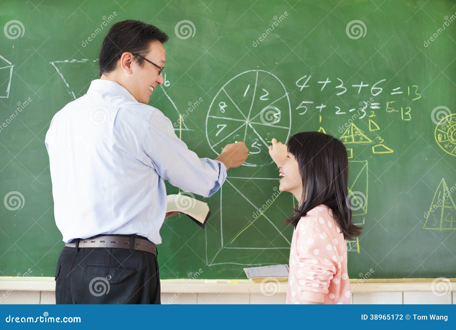 Teacher Teach Student To Solve The Math Questions Stock Photo - Image: 389651721300 x 957