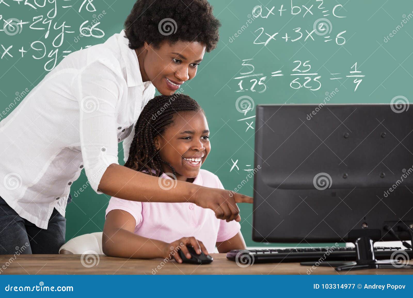teacher teaching her student in class
