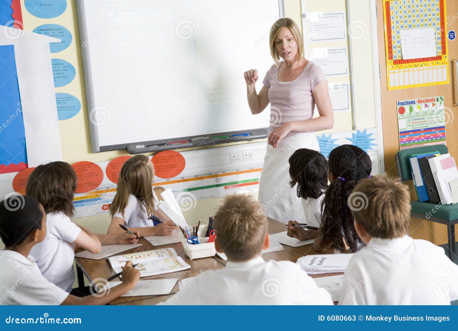 a teacher teaching a junior school class