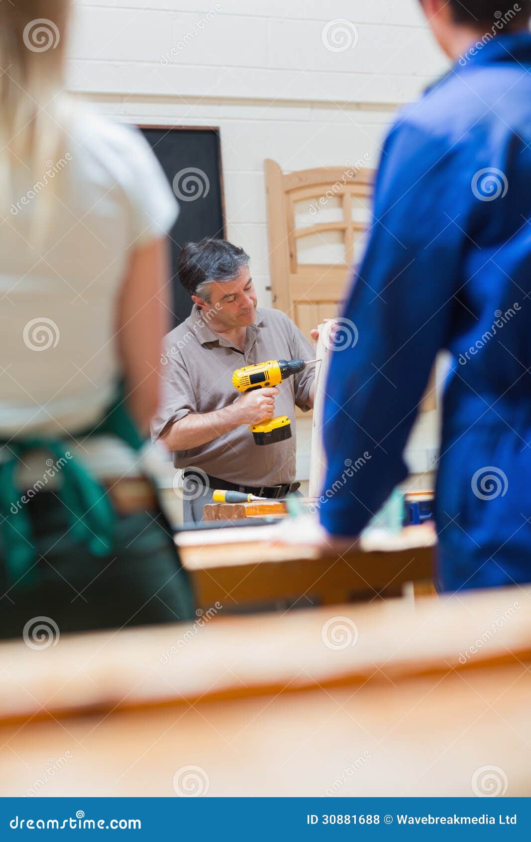 Teacher of a Woodworking Class Explaining Stock Photo Image of plank