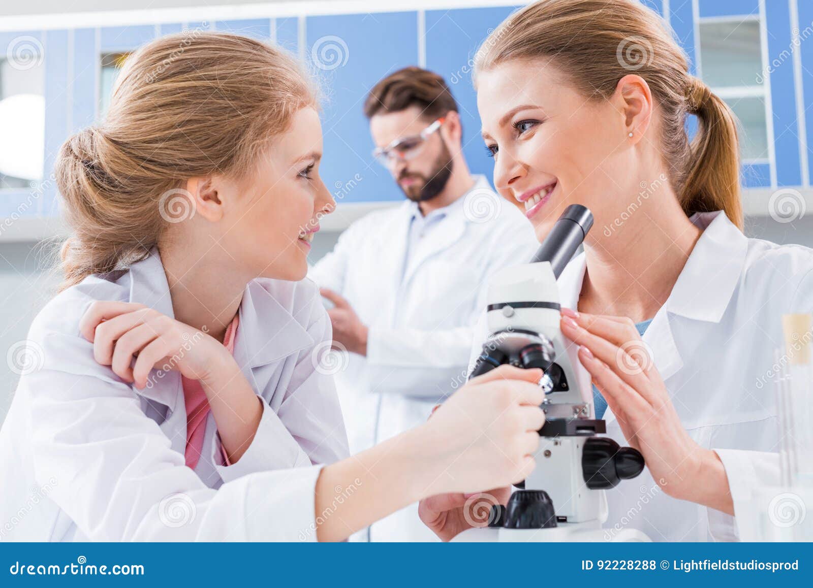 Teachers Scientists and Student Chemists in White Coats Working