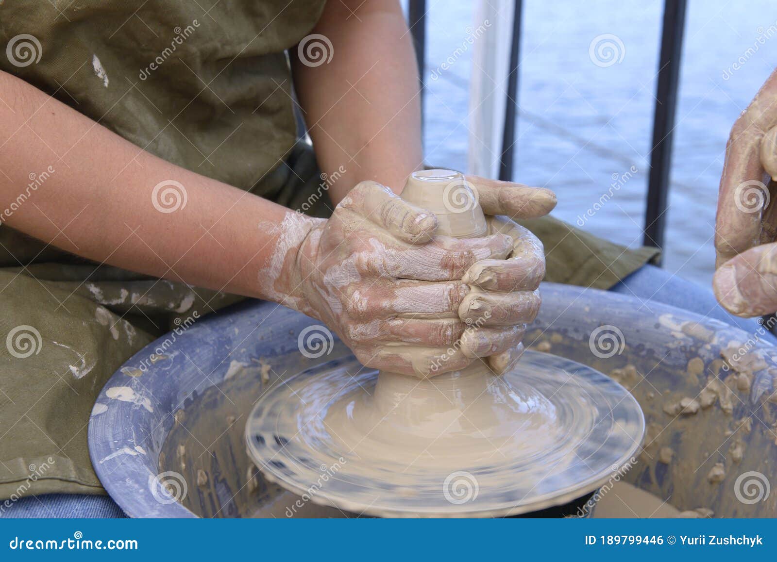 Download Teaching Of Wheel Throwing. Potter Hand Correcting Woman Ones During Shaping Clay Blank On The ...