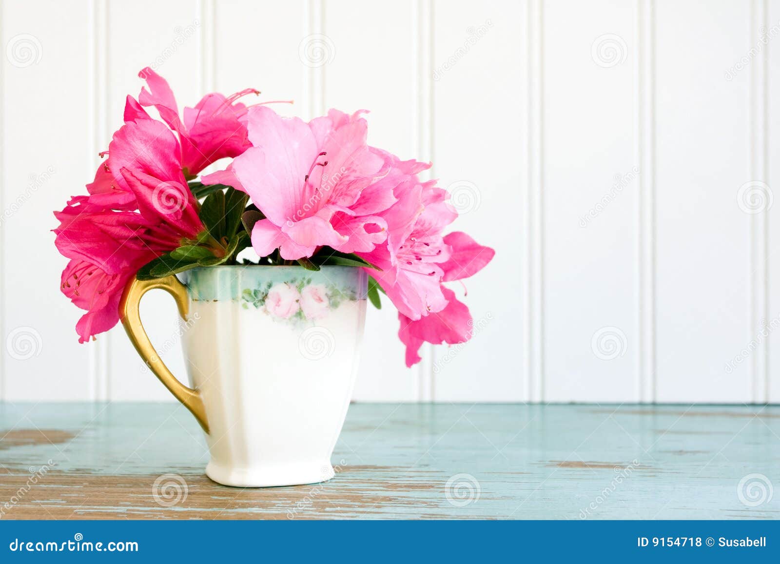 teacup with azalea flowers