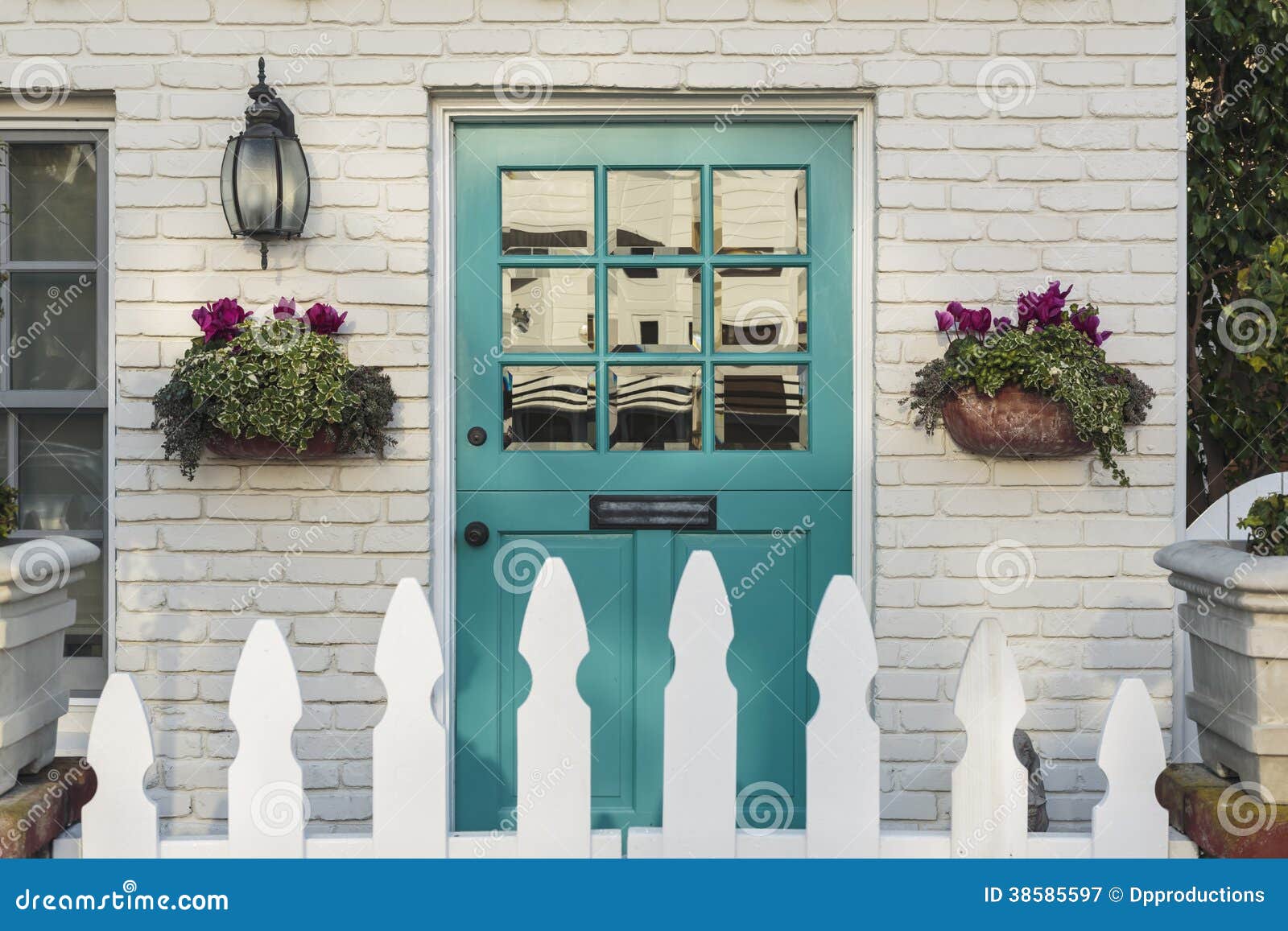 teal front door of a classic home