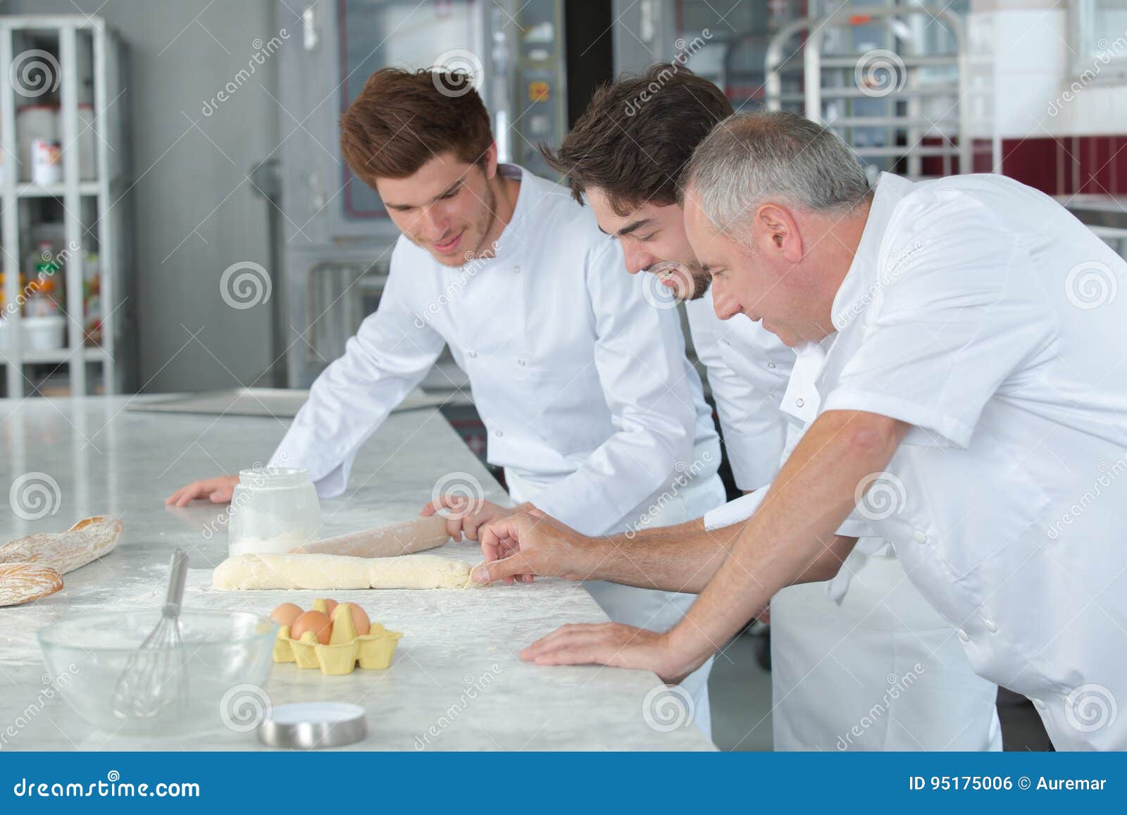 Team Bakers Kneading Dough in Commercial Kitchen Stock Photo Image of