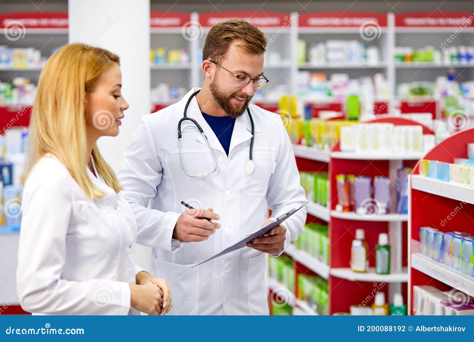 team of chemists or druggists discussing medicines, check