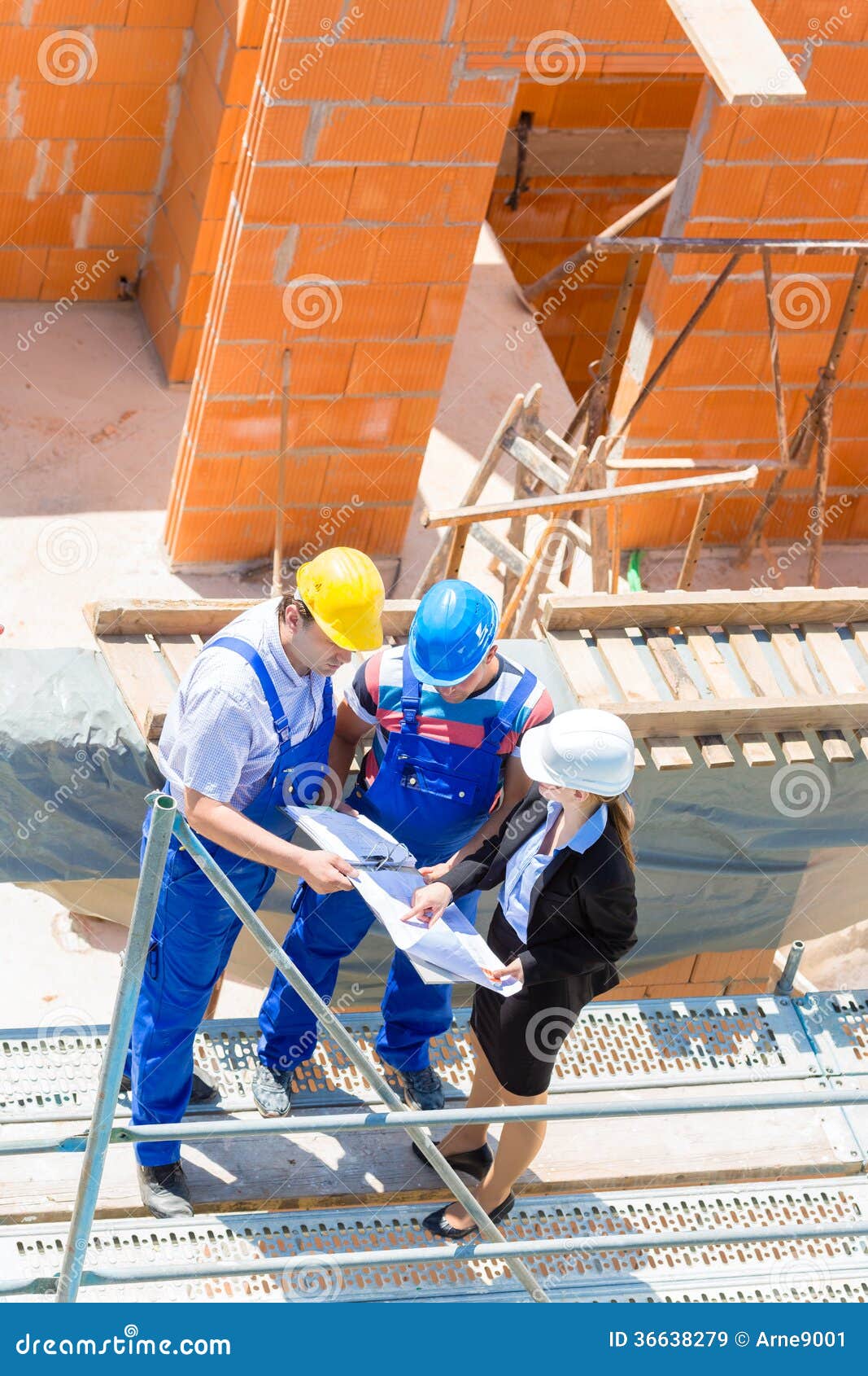 team discussing construction or building site plans