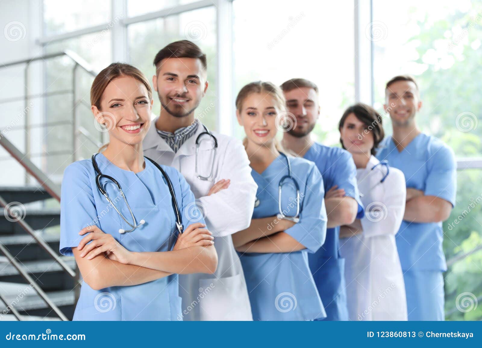 Team of doctors in uniform stock image. Image of coat 123860813