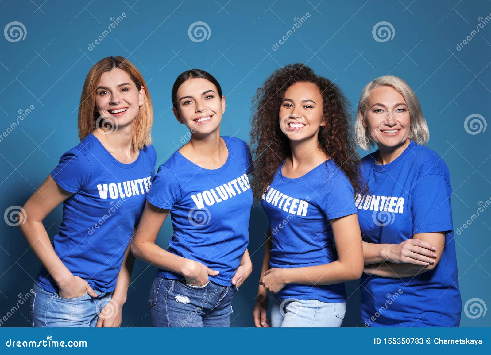 Team Of Female Volunteers In Uniform On Blue Stock Image  Image of