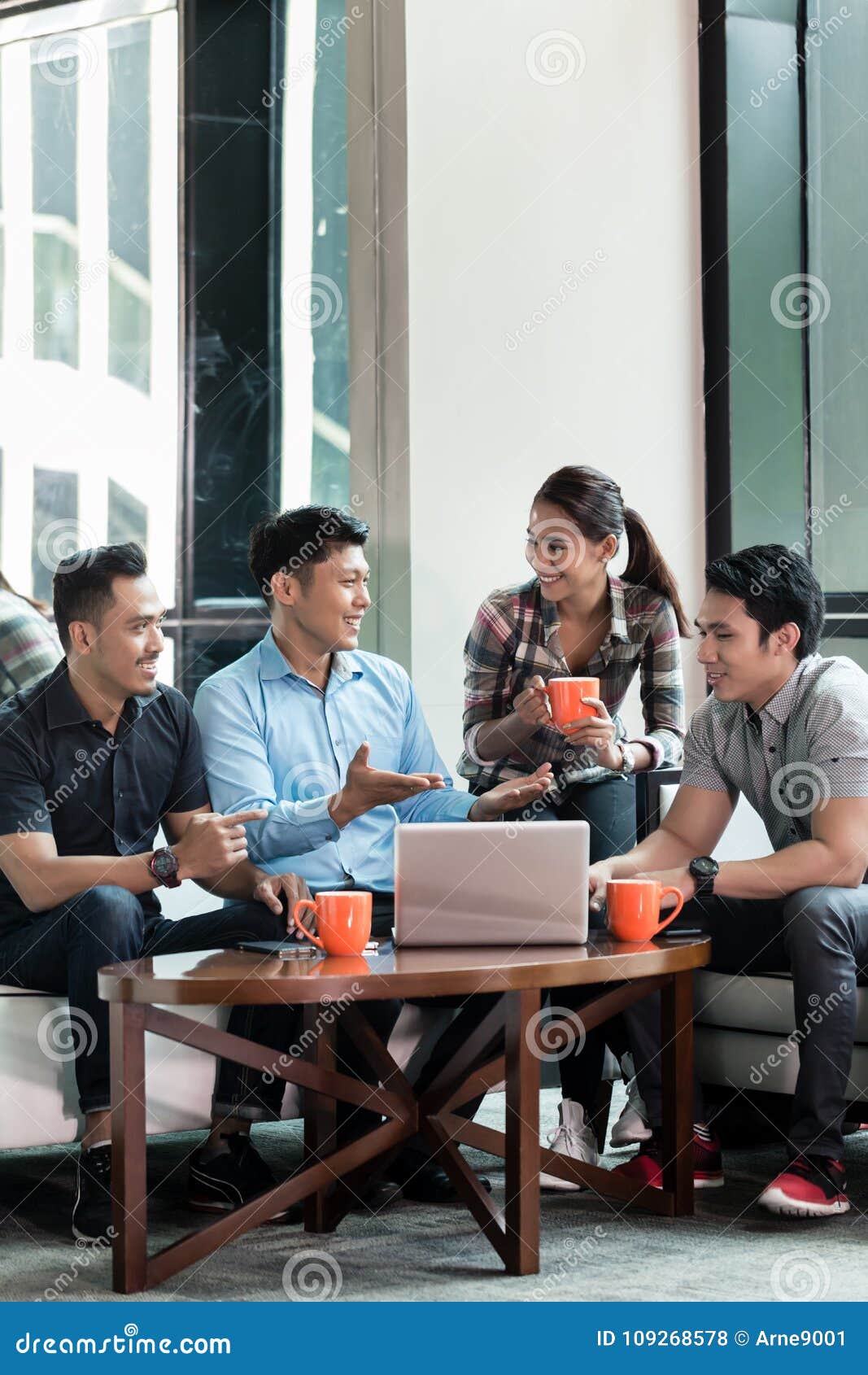 team of four dedicated employees working together