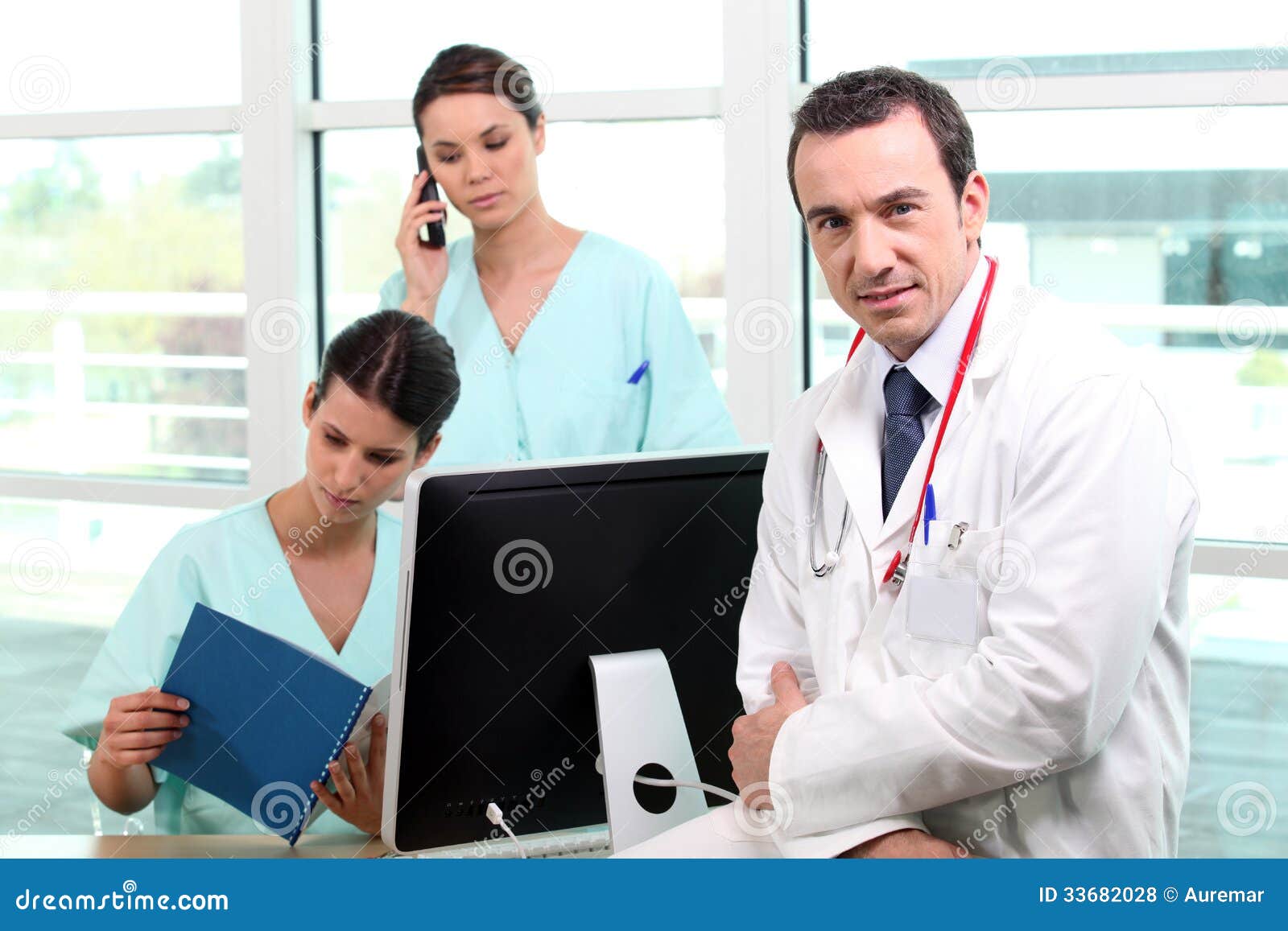 A Team of Medical Professionals Stock Photo Image of folders, boss