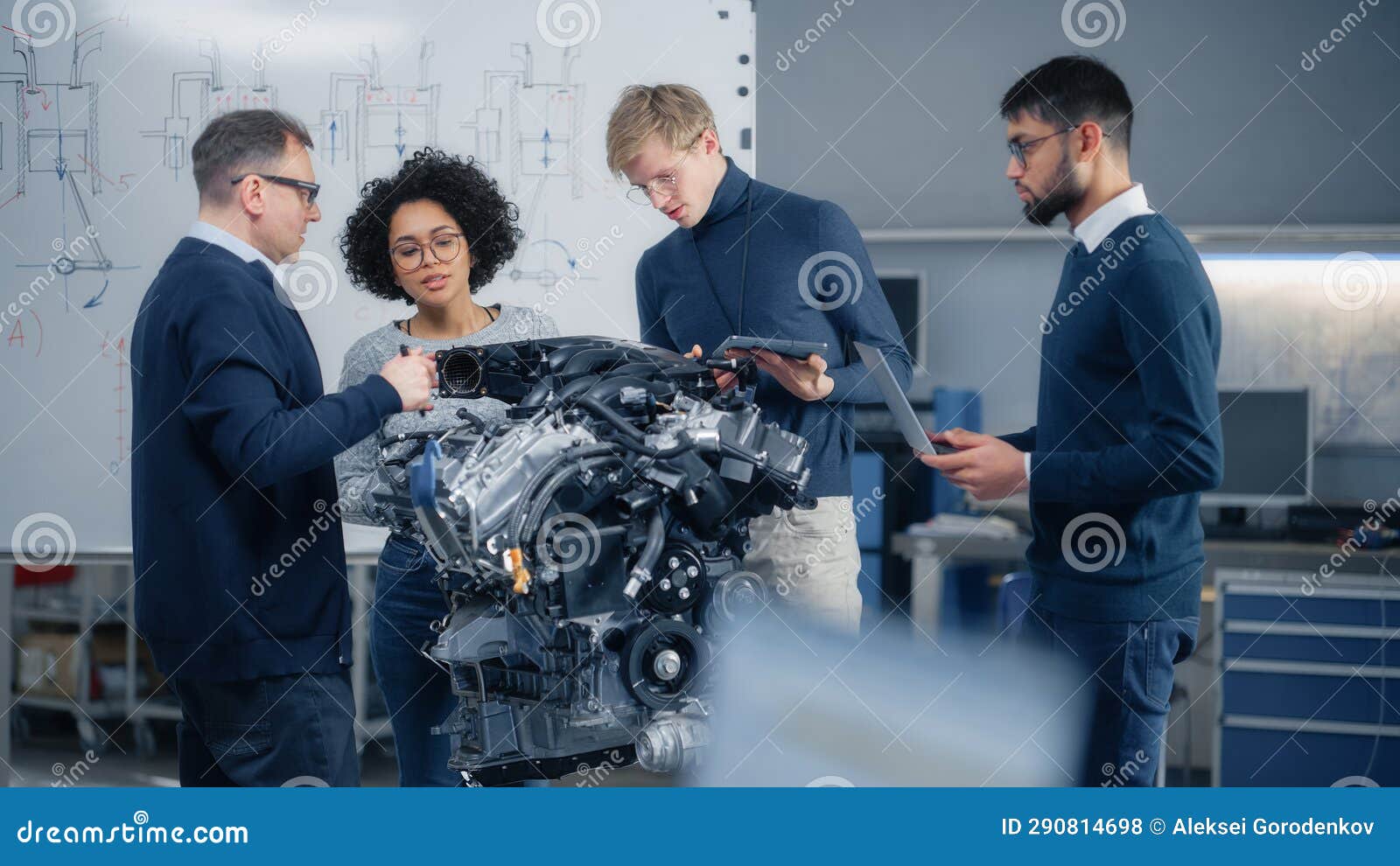 Team Meeting of Engineers Working on Innovative Electric Motor. Group