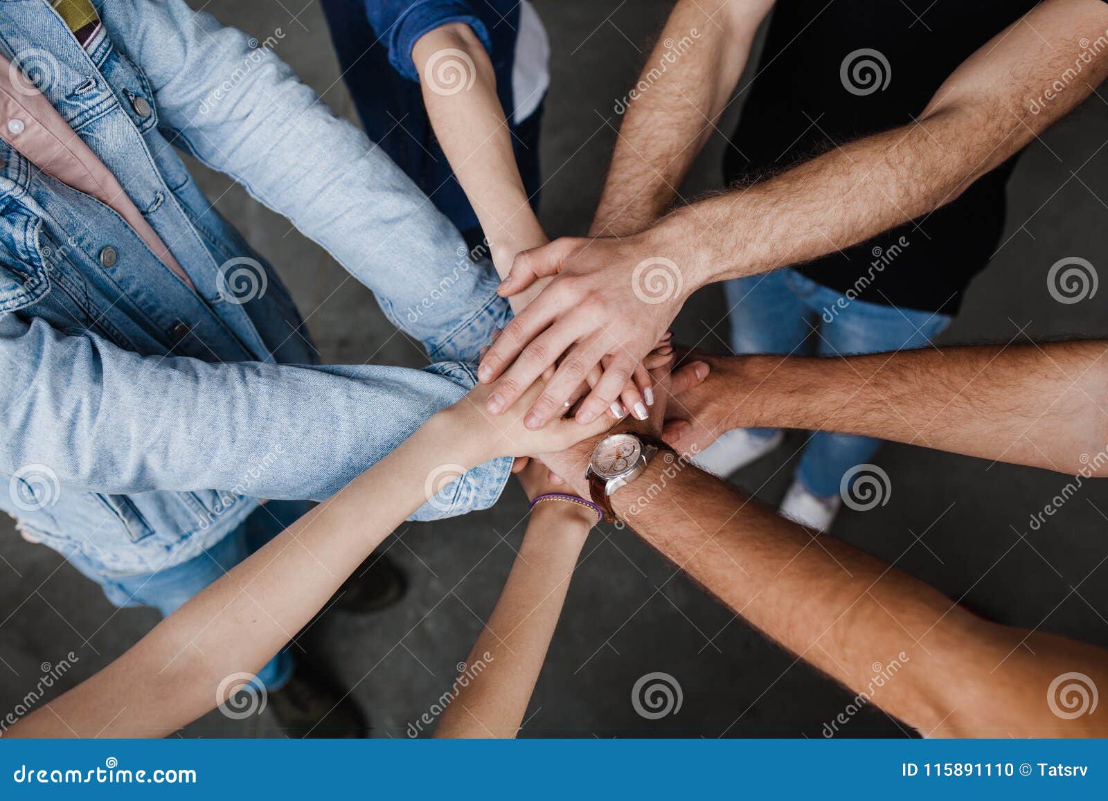 team put hands together, show connection and alliance, teambuilding in office, young businessmen and women in casual