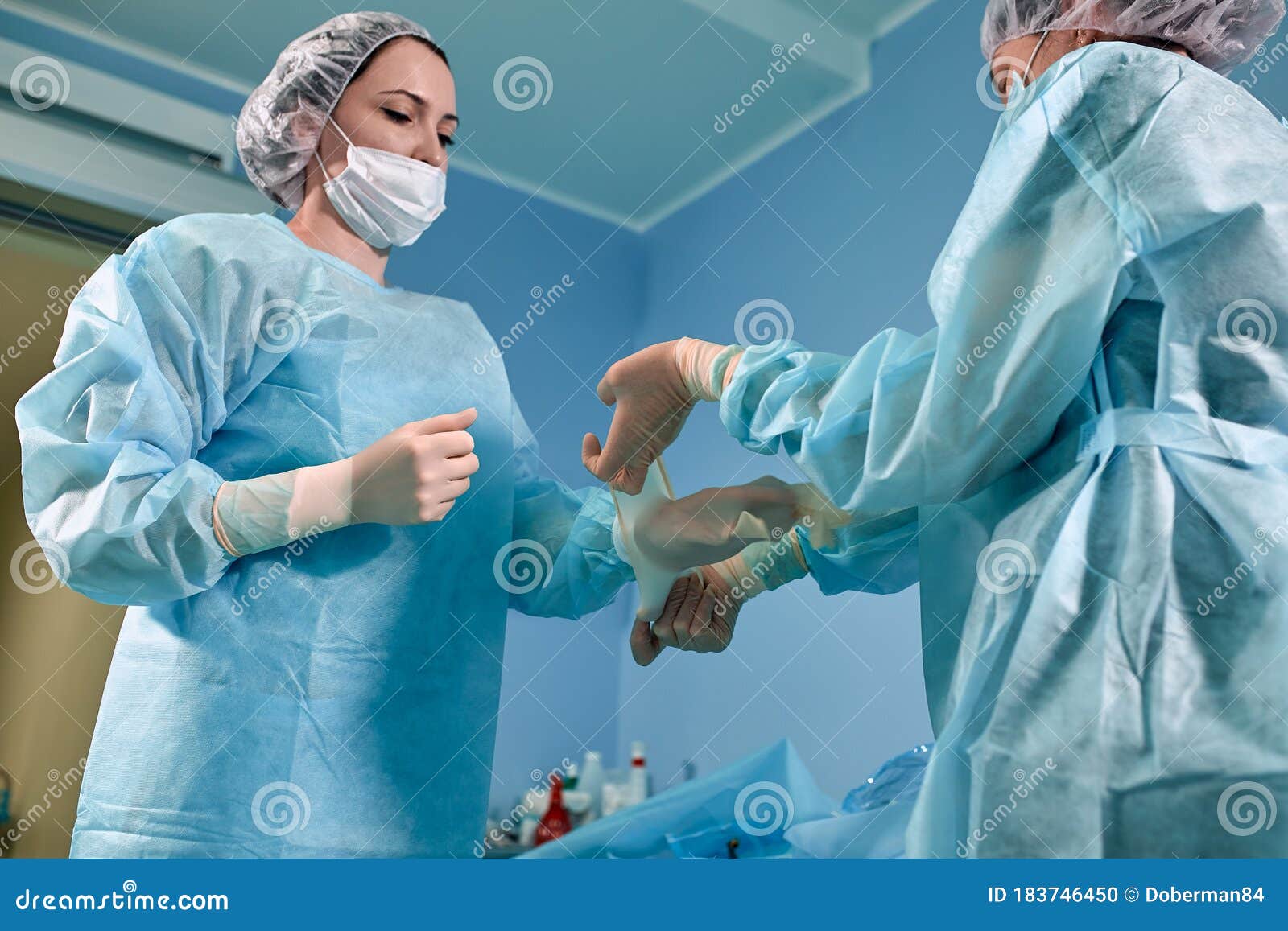 Doctor Gowning For Surgery Stock Photo CartoonDealer 35740068 doctor-gowning-for-surgery-stock-photo-cartoondealer-35740068