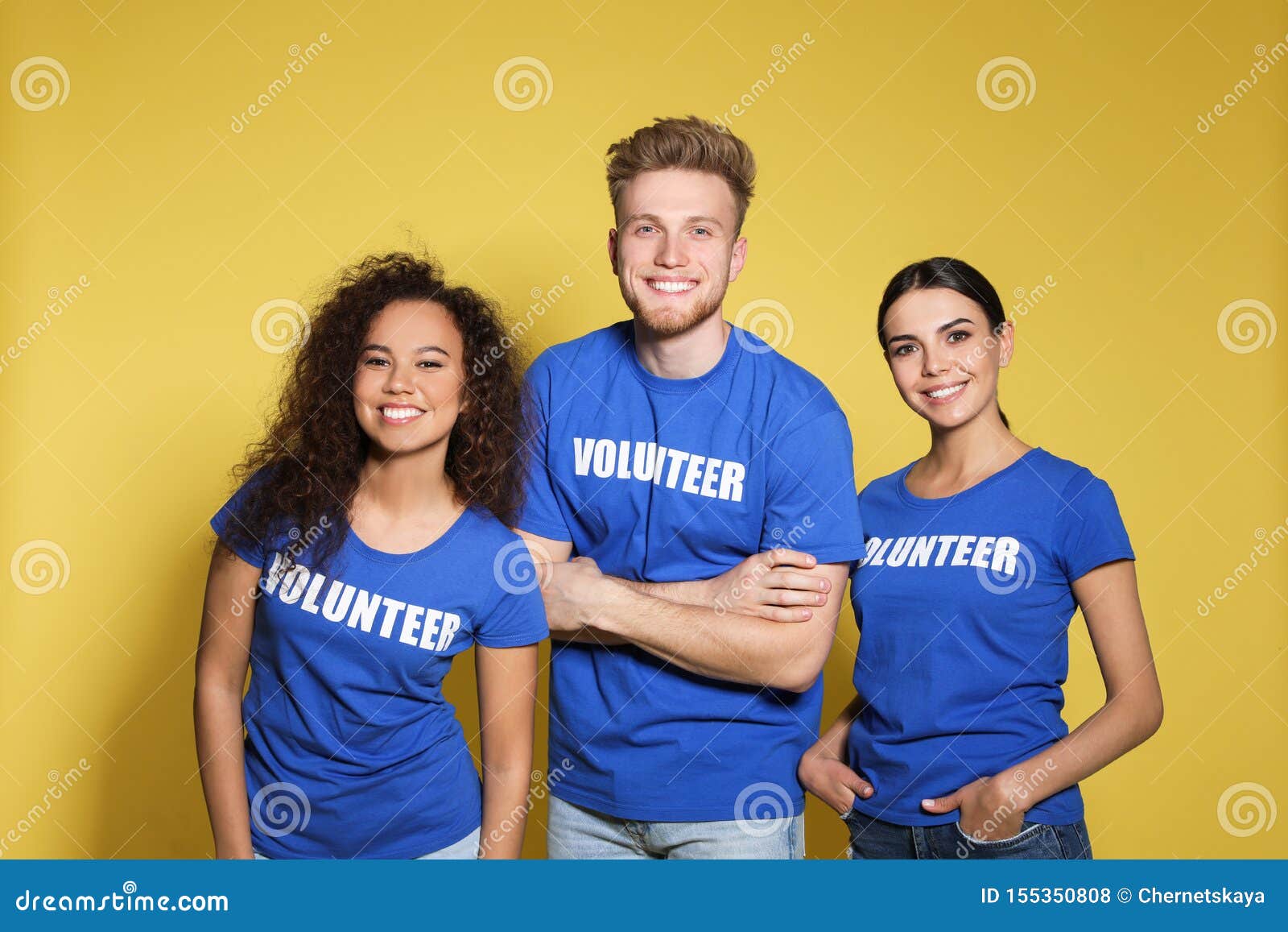 Team Of Volunteers Collecting Food Donations At Table Royalty Free