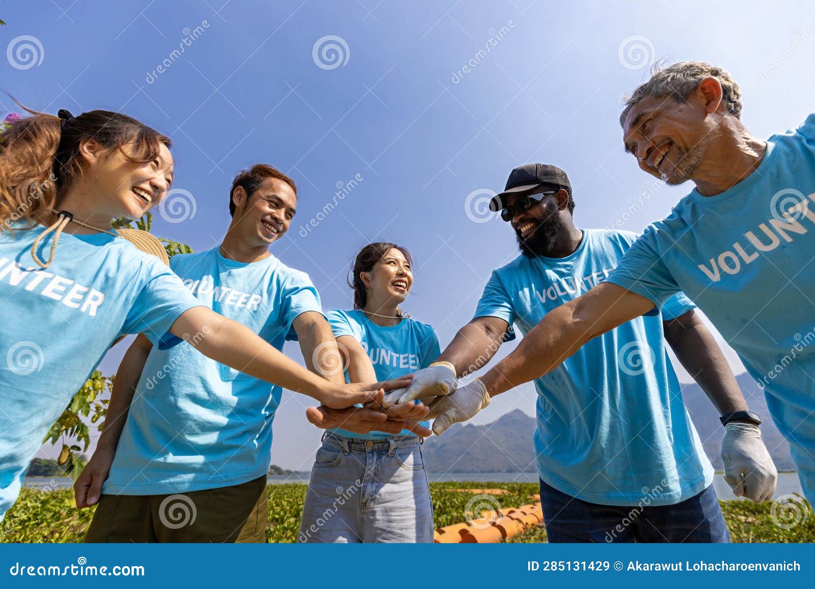 team of young and diversity volunteer worker group enjoy charitable social work outdoor together in saving environment project